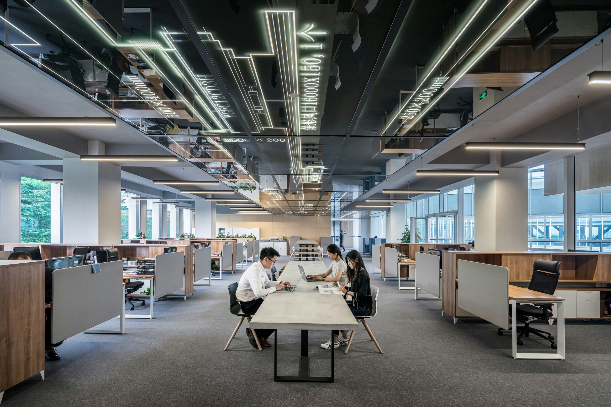 Wide shot of office with people working