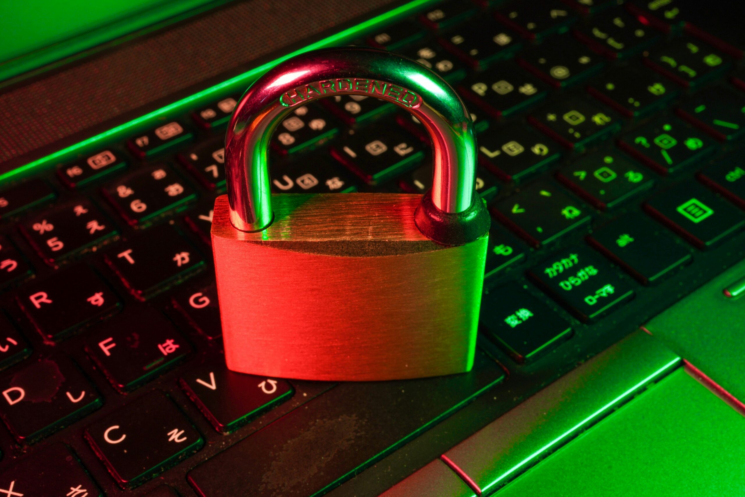 Lock on top of laptop keyboard symbolizing cybersecurity
